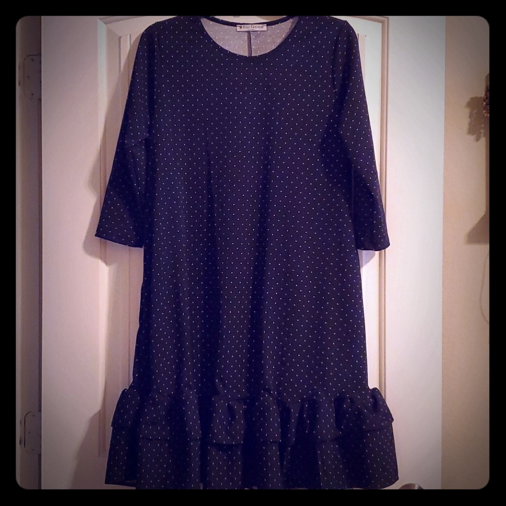 Black dress with white polka dots and side pockets